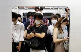 Suga to declare state of emergency in Tokyo area as virus surges