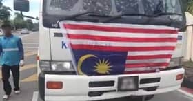 Bendera terbalik: Polis tahan pemandu lori, empat pekerja