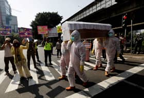 In Indonesia, shock coffin tactics nail coronavirus risks