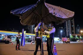 Motorist using handphone nabbed after ramming roadblock