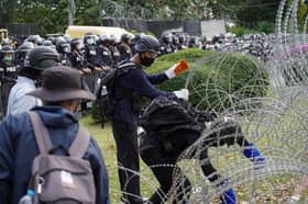 Thai protesters march to barracks against King's military power