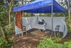 Father sets up daughter's 'classroom' in tent atop hill
