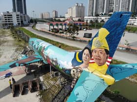 Portraits of Selangor Sultan, Tengku Permaisuri adorn airplane-turned-restaurant