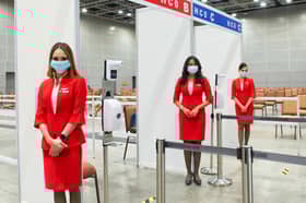AirAsia volunteers add a touch of air travel luxury to vaccination centres