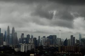 Malaysia's economic recovery momentum may be derailed by Covid-19 surge