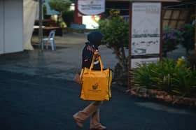 Malaysian volunteers in Singapore join global efforts to bring postal votes for GE15