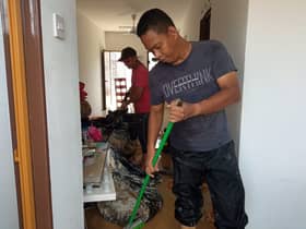 Father carries autism son, waded through floods barefooted