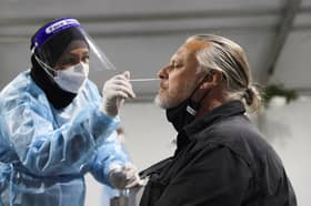 Australia records first Covid-19 Omicron death, authorities stick to reopening plan