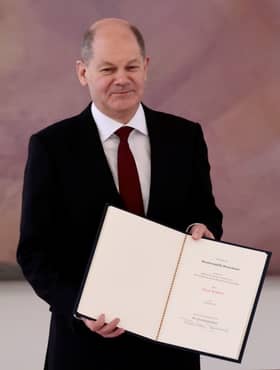 Scholz takes over as German chancellor, ending Merkel era