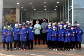 King, Queen present donations to poor, orphans