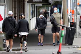 New Zealand announces free masks, tests as health system struggles with Covid