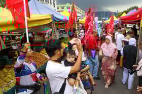 GE15: Rain does not deter Rodziah from visiting locals, use social media during bad weather