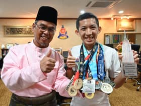Tower runner champion shares his achievement with Petaling Jaya mayor