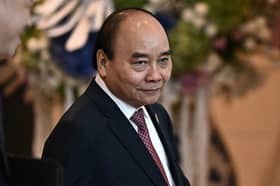 Vietnam's President Phuc quits, blamed for ministers' 'violations'