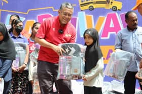 Sg Ramal students receive back-to-school vouchers, incentives to open Tabung Haji accounts