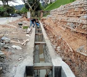 MPAJ maintains, repairs slope near condominium for safety of residents