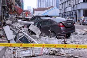 Roof structure of five-storey building collapses, several vehicles damaged