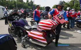 Berhabis RM5,000 jelajah negara guna motosikal berhias Jalur Gemilang