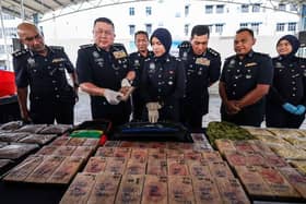 Cops bust heroin lab, seize RM1.87 mln in drugs