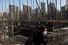 China's third quarter economic growth beats market forecast but headwinds persist