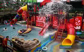 Father turns backyard into mini water park for kids