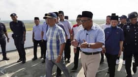 Agong visits Paddy Gallery in Sekinchan, tries hands at harvesting machine