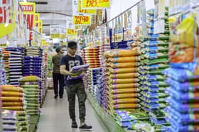 Govt says no law against mixing local white rice with imported grain