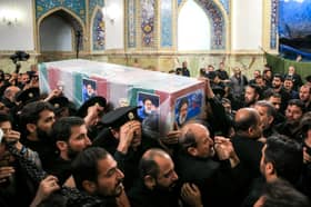 Iran's Raisi buried in Mashhad as mourners pack Iranian holy city