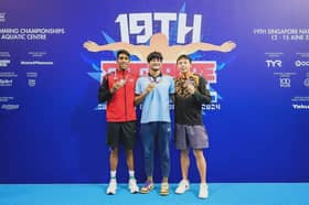 Two national swimmers clinch bronze in Singapore