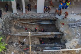 Rescuers to use telescopic camera in latest effort to locate sinkhole victim