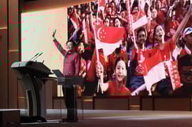 Singapore PM calls for attitude reset, offers perks at national day rally