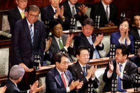 Japan PM survives Parliament vote as Trump looms large