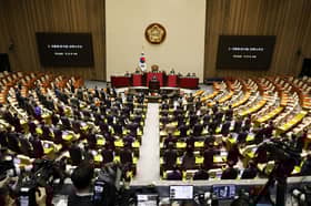 Shouting, curses as South Korean president's party boycotts martial law impeachment vote
