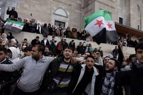 Syrian rebels topple President Assad, Russia says he left the country