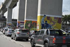 LRT station's pillars decorated with murals to support artists, curb graffiti