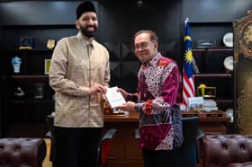 Anwar receives courtesy call from preacher Omar Suleiman