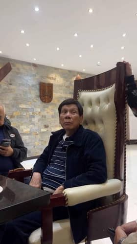 Philippines puts ex-President Duterte on plane en route to ICC