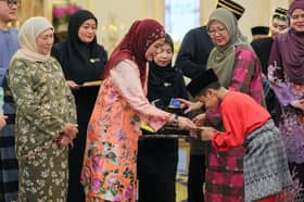 Queen graces breaking-of-fast event with single mothers, orphans