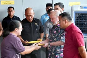 King presents aid to Putra Heights disaster victims
