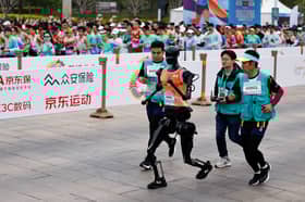 China pits humanoid robots against humans in half-marathon