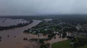 Torrential rain ravages Australian towns, thousands brace for isolation