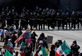 Los Angeles police order immigration protesters downtown to go home