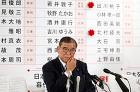 Japan ruling camp loses upper house majority, PM vows to stay on