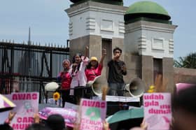 With brooms in hand, Indonesian women march for change