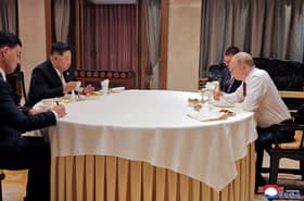 Staff wipes off all traces of Kim Jong Un after Beijing meeting with Putin
