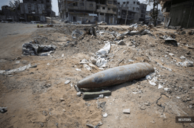 Clearing Gaza's surface of bombs will take up to 30 years, aid group says