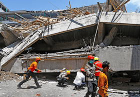 Indonesian rescuers race against time to save students trapped under rubble of collapsed school