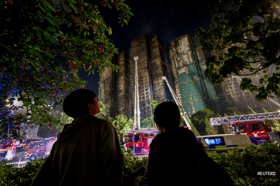 Hong Kong nears end of rescue mission as tower fire toll rises to 94