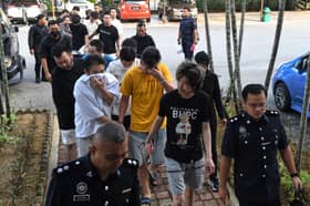 18中日男女被控跨国诈骗  全数不认罪准以8000保外