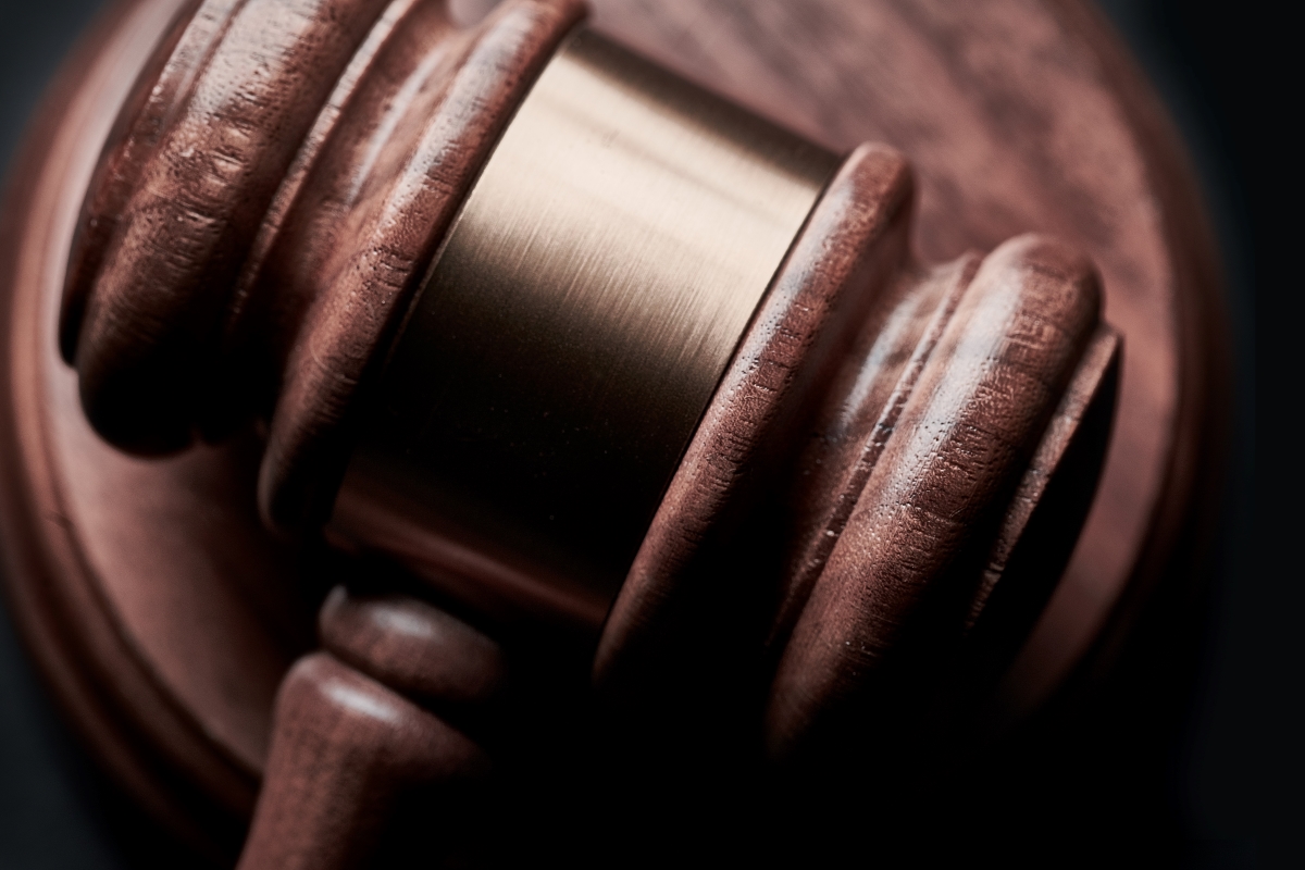 Man claims trial to showing obscene gesture, kicking food delivery rider